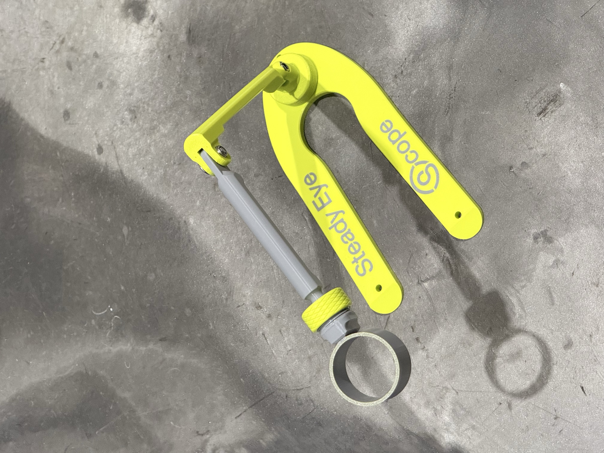 SteadyEyeScope instrument laid flat, deployed with sight ring extended