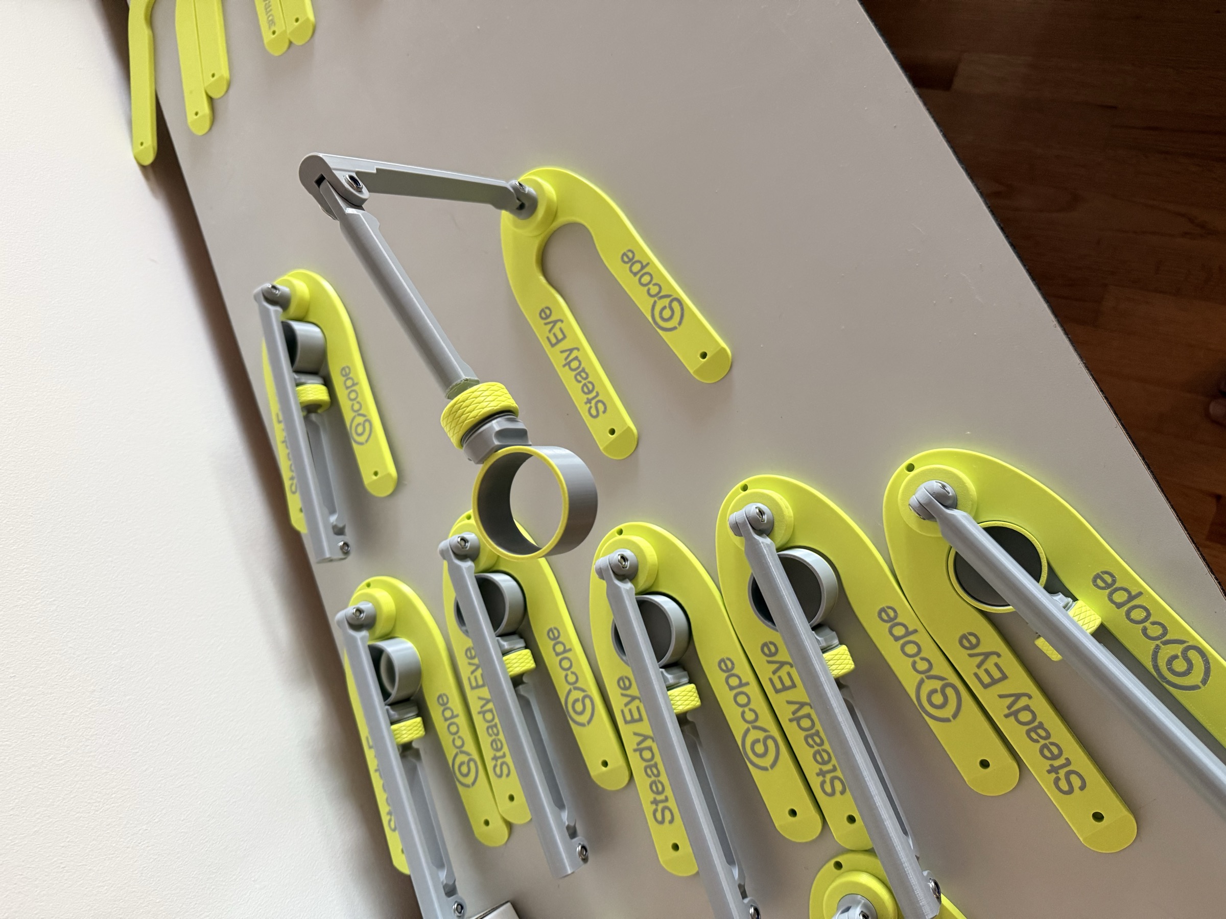 A small batch of SteadyEyeScope units laid out for inspection